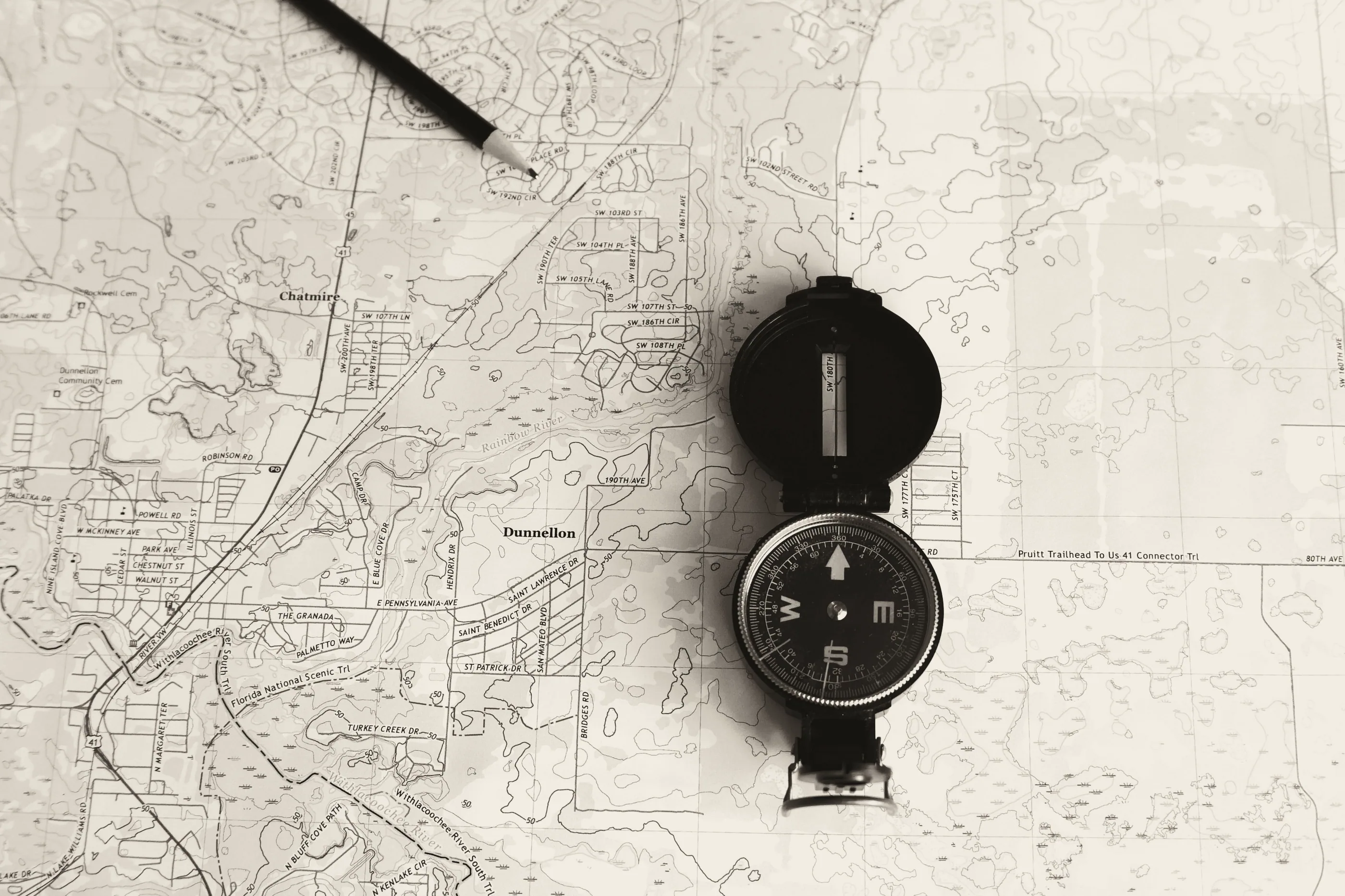 Topographic map with a compass and pencil